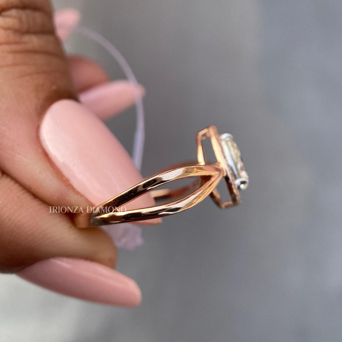 Pear cut intense yellow lab grown diamond ring displayed in 14k gold fancy design setting