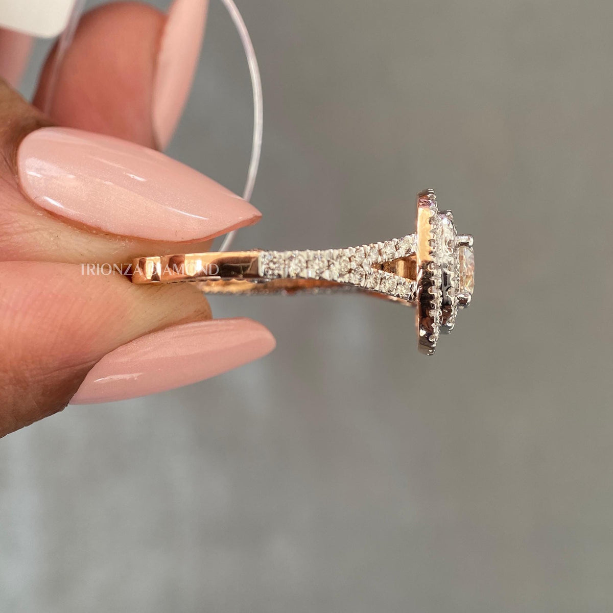 Side profile of the 14K gold ring showing the double cushion halo silhouette