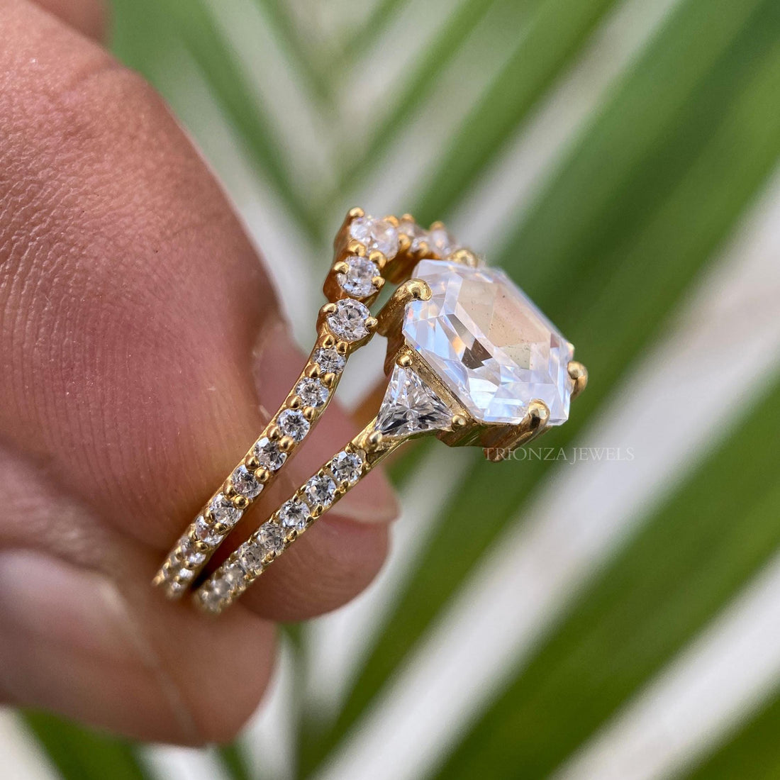 Hexagon cut moissanite bridal set featuring trillion cut side stones in handmade 14k gold