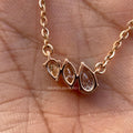 Close-up of the pear and marquise cut diamonds set in a flower-inspired design