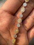 Woman wearing the fancy yellow diamond tennis bracelet on her wrist for an elegant look