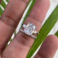 Close-up of the 4 CT cushion cut moissanite diamond set in a prong and halo setting