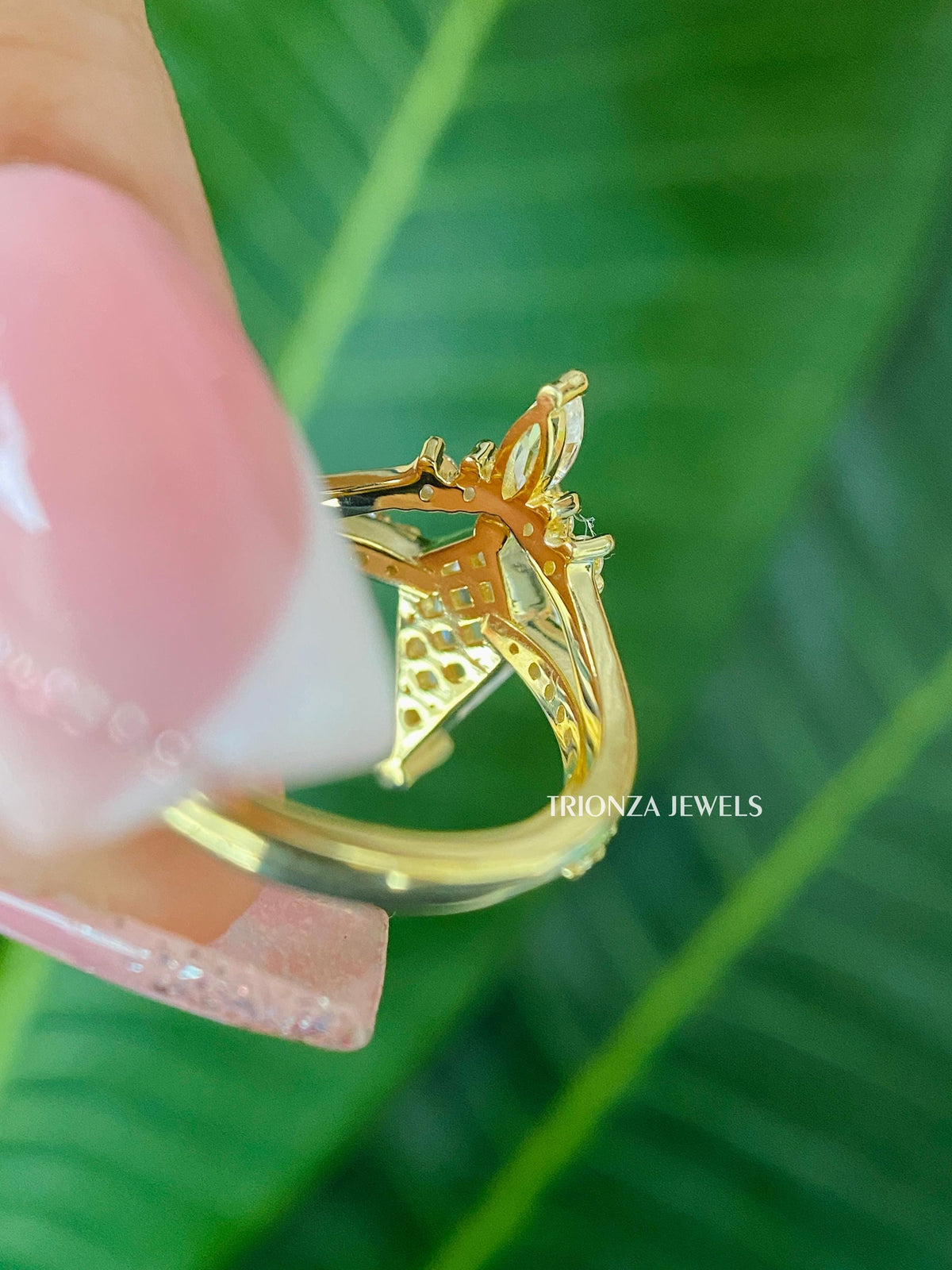 Woman wearing the kite cut moissanite wedding ring set, close-up on her hand