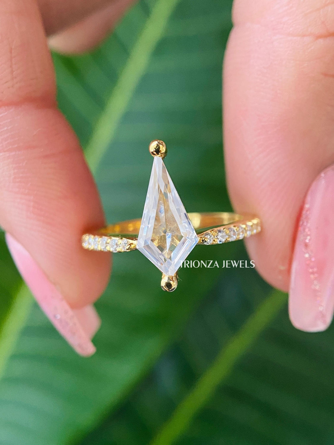 Kite cut moissanite engagement ring featuring an antique Art Deco inspired design