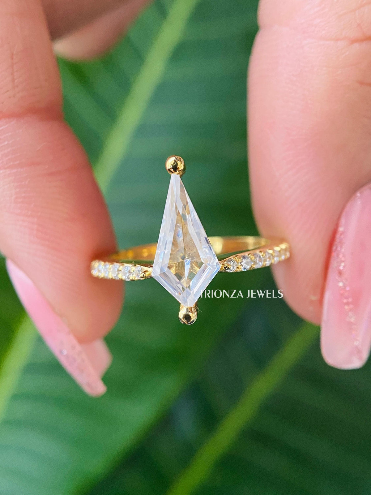 Kite cut moissanite engagement ring featuring an antique Art Deco inspired design