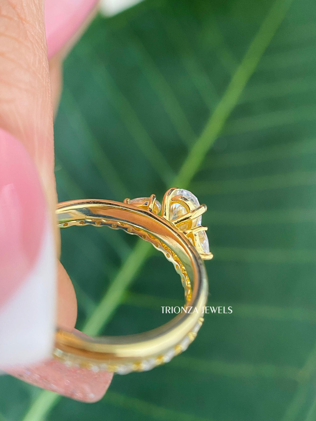 Matching wedding band and three stone engagement ring set designed for a bridal or anniversary gift