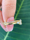 14k yellow gold moissanite ring set displayed in a jewelry box with smooth fabric included