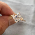 Woman wearing the marquise cut engagement ring, close-up on her hand