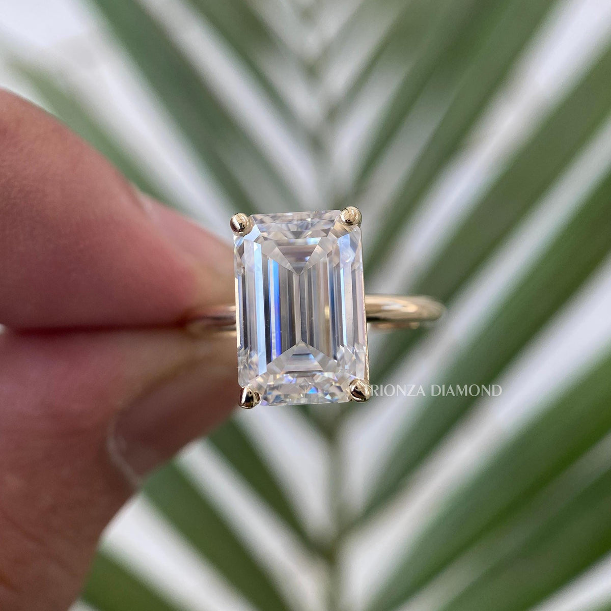 Yellow gold emerald cut solitaire ring crafted with a handmade bezel setting design