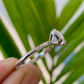 Handmade art deco style ring crafted with an emerald cut moissanite centerpiece