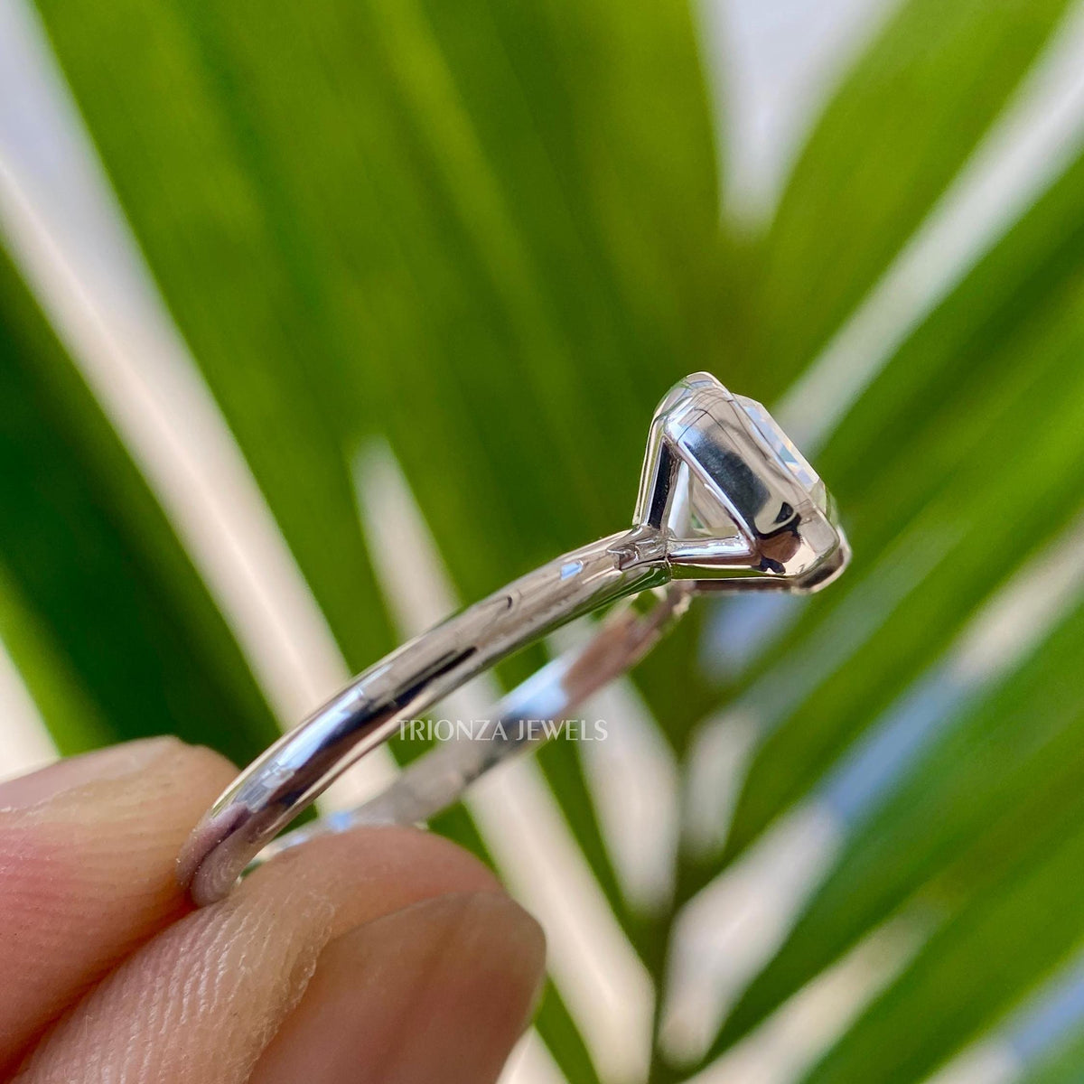 Handmade art deco style ring crafted with an emerald cut moissanite centerpiece