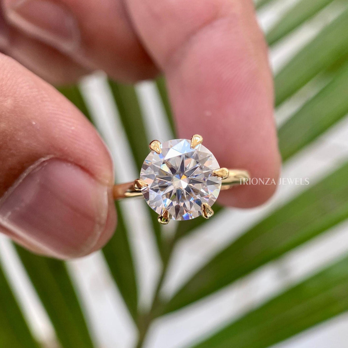 Gold promise ring for her displayed in a jewelry box with smooth fabric included