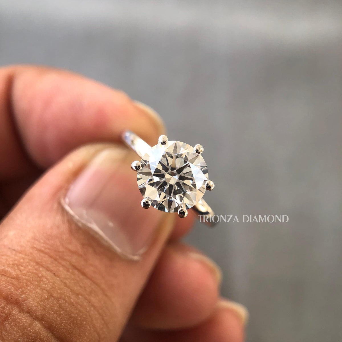 Round cut lab grown diamond solitaire ring featuring a 1.50 CT D color VVS2 center stone