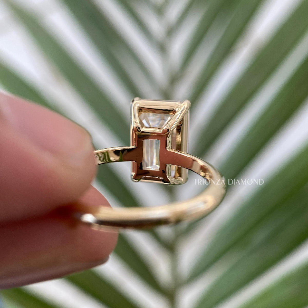 Side view of the emerald cut moissanite ring showing the 8.00 x 12.00 MM stone measurement