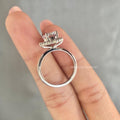 Minimalist bridal ring featuring a classic halo set solitaire design for everyday elegance