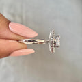 Woman wearing the round diamond halo ring, displayed for a natural sunlight shot