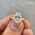 3 CT oval cut lab grown diamond engagement ring displayed with its certification details