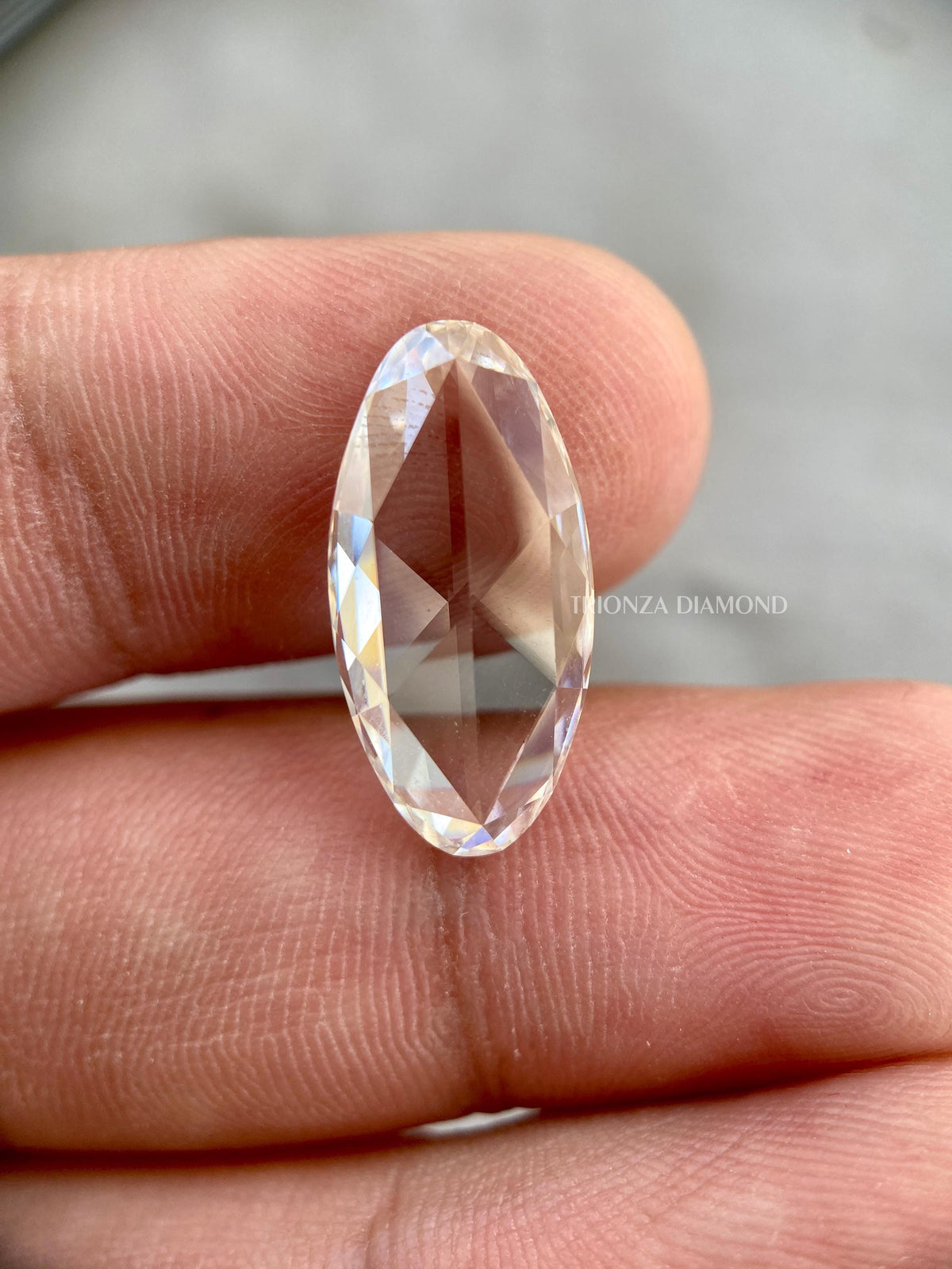 Close-up of the 5.70 CT oval rose cut diamond showing its colorless VS1 clarity
