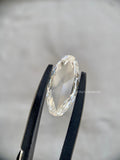 Vintage style rose cut diamond photographed to show its measurement and elongated oval shape