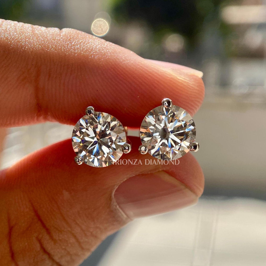 Round cut lab grown diamond stud earrings set in 18K gold with a secure 3 prong design