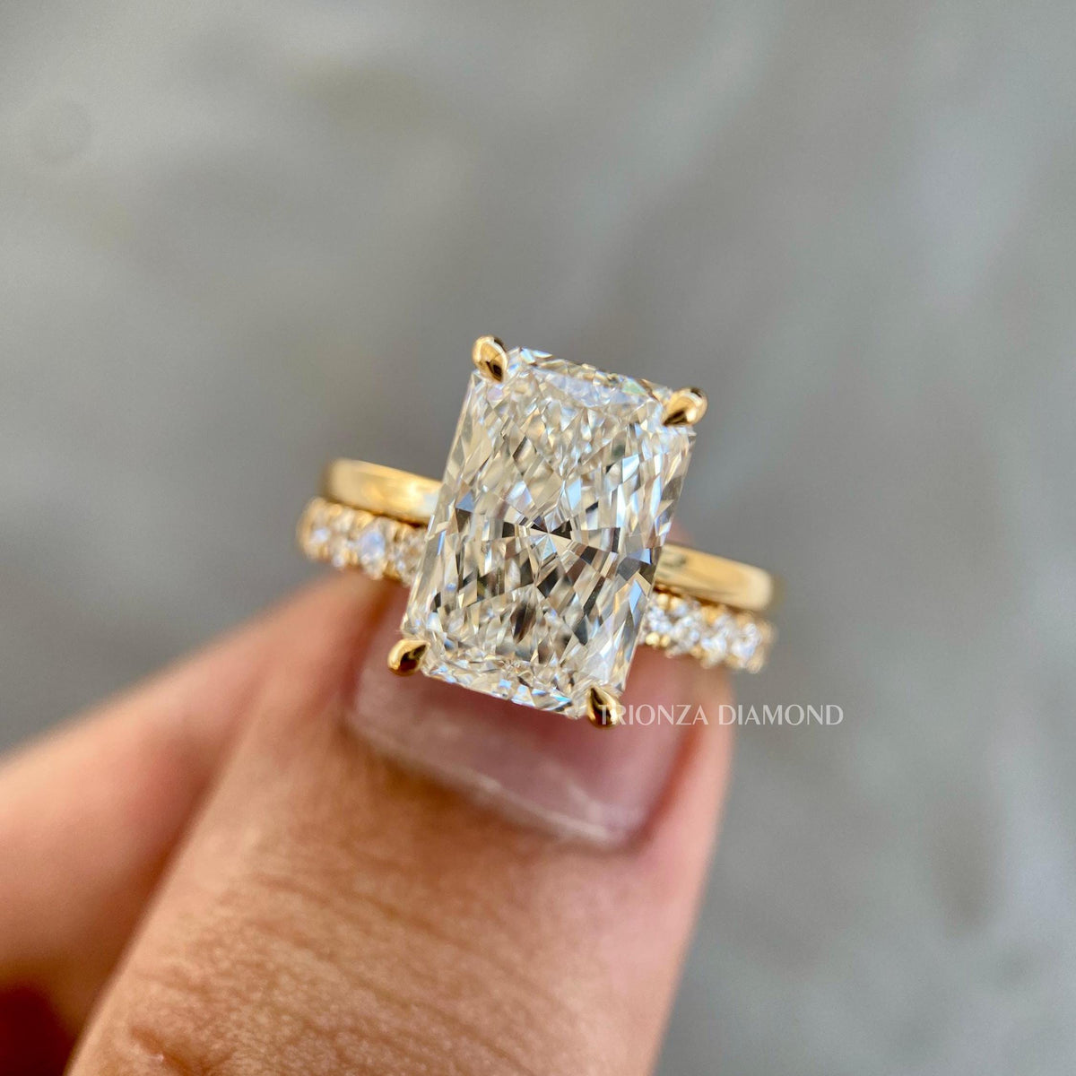 Gold radiant cut ring designed as a custom bridal ring for women