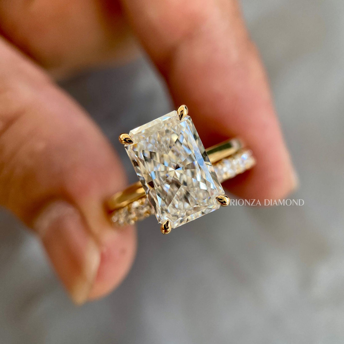 Radiant cut lab grown diamond engagement ring featuring a 3 CT F/VS1 center stone in gold