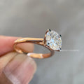 Round lab grown diamond ring photographed in natural sunlight to show its brilliance