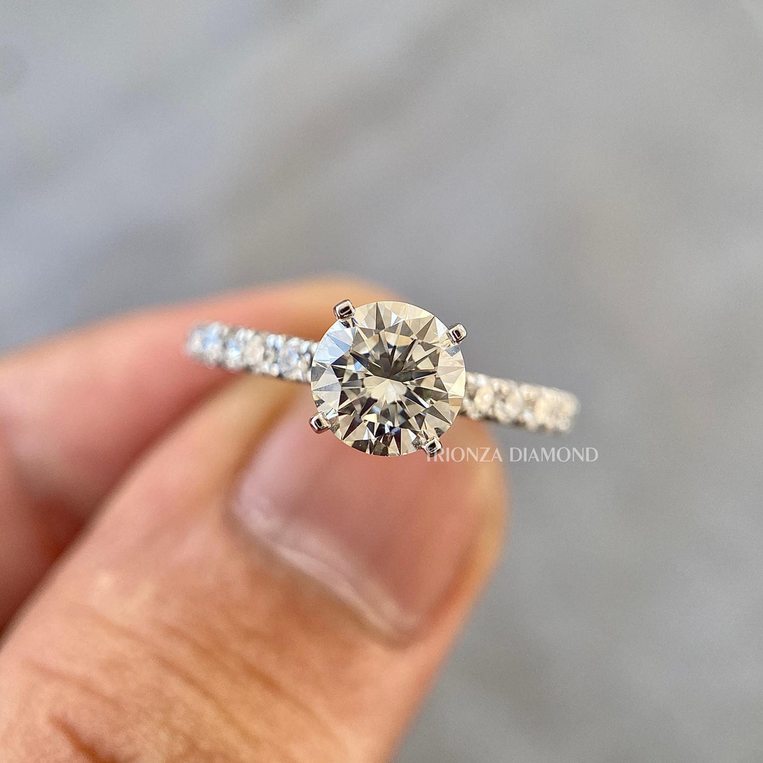 Round cut lab grown diamond ring featuring a classic pave setting for everyday elegance