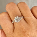 Woman wearing the 14K white gold heirloom ring with a round cut lab grown diamond