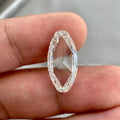 Elongated oval rose cut lab grown diamond displayed to highlight its flat cut faceting