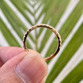 TrionzaDiamond wedding band displayed in a jewelry box with a smooth cleaning fabric