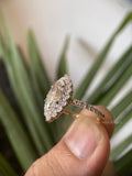 Marquise moissanite ring displayed in a jewelry box with smooth fabric included