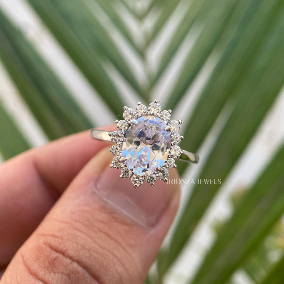 Handmade moissanite engagement ring crafted with prong and halo setting details
