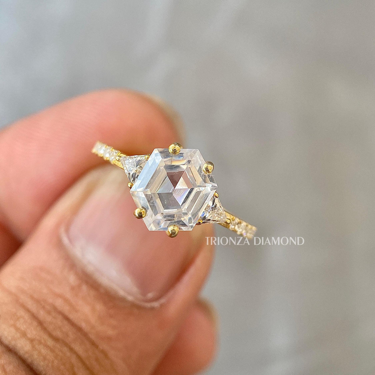Radiant cut lab grown diamond engagement ring featuring a triangle side pave setting