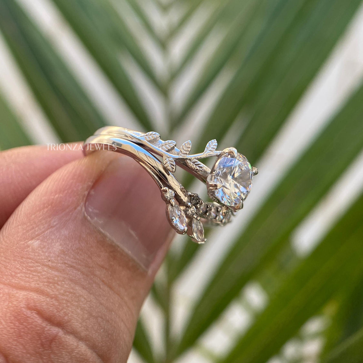 Handmade leaf design wedding band paired with a vintage round cut engagement ring