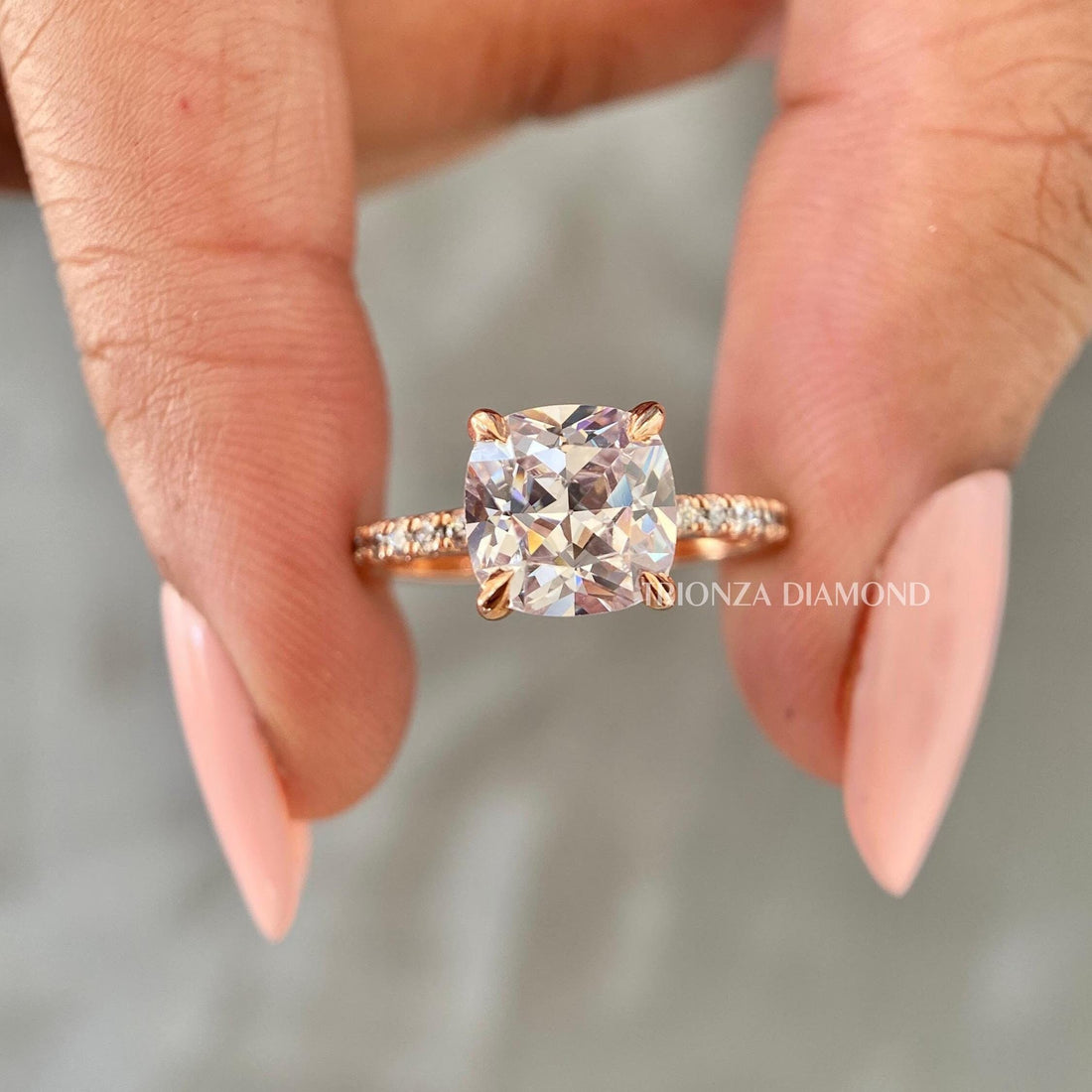Cushion cut lab grown diamond ring in 18K rose gold showcasing a brilliant D color VVS2 stone