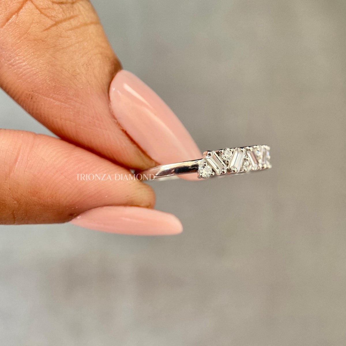 Close-up of the 0.56 TCW colorless diamond band showing D/E VVS-VS clarity and brilliance