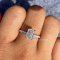 Woman wearing the emerald cut lab diamond ring, showcasing its handcrafted setting