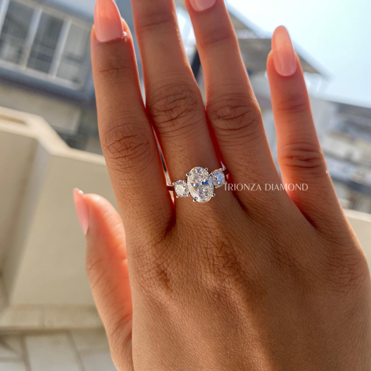 Close-up of the IGI certified oval diamond ring showing the D color and VVS2 clarity brilliance