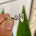 Close-up of the oval moissanite center stone showing its colorless VVS clarity