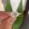 Woman wearing the handmade oval moissanite engagement ring on her hand
