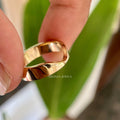 Close-up of the V shaped stacker ring highlighting its minimalist wide band style