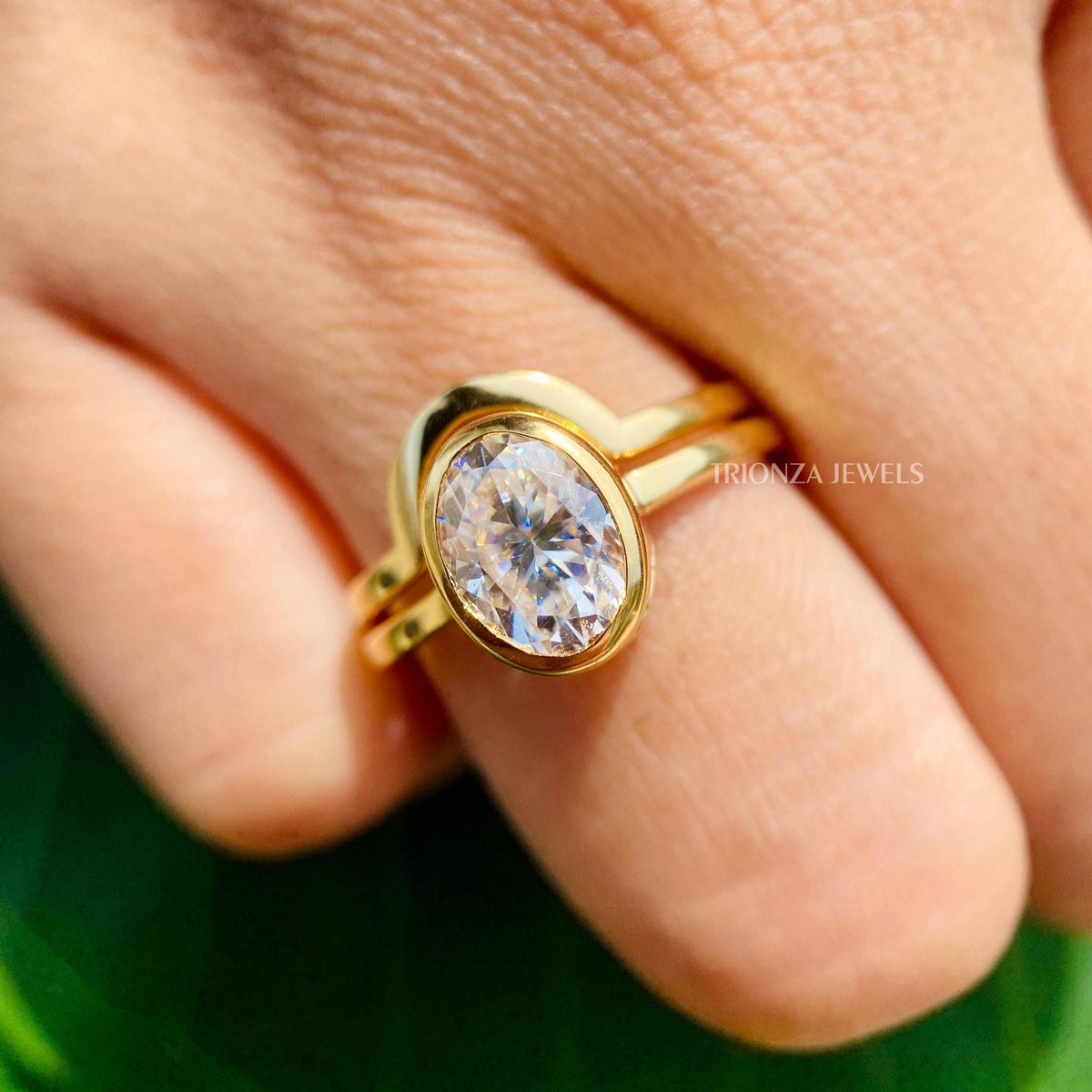 TrionzaDiamond engagement ring shown with a jewelry box and smooth cleaning fabric