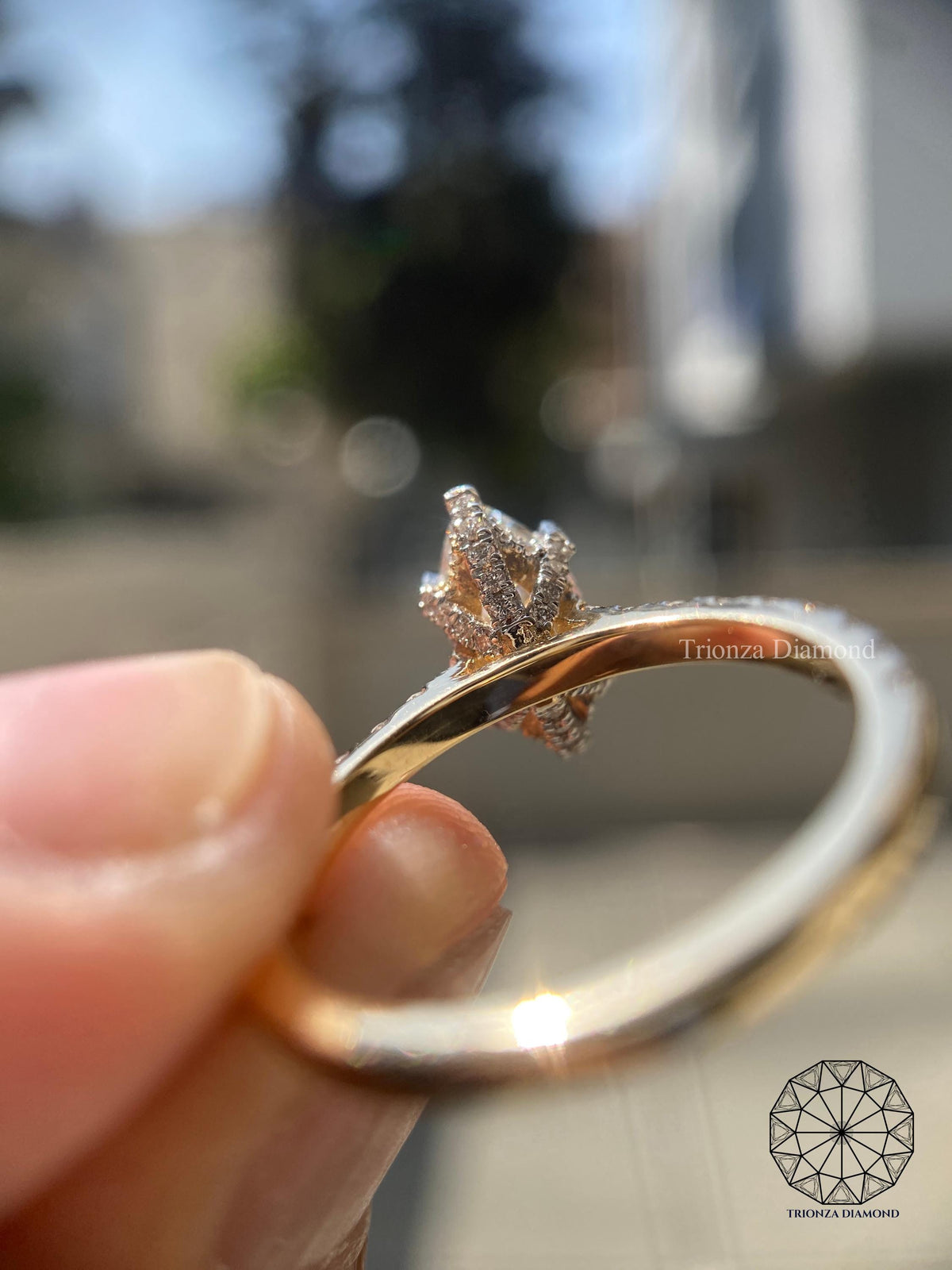 Hidden halo cathedral setting designed to add extra sparkle around the marquise diamond