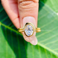 Oval moissanite solitaire ring available in yellow, rose, or white gold finish
