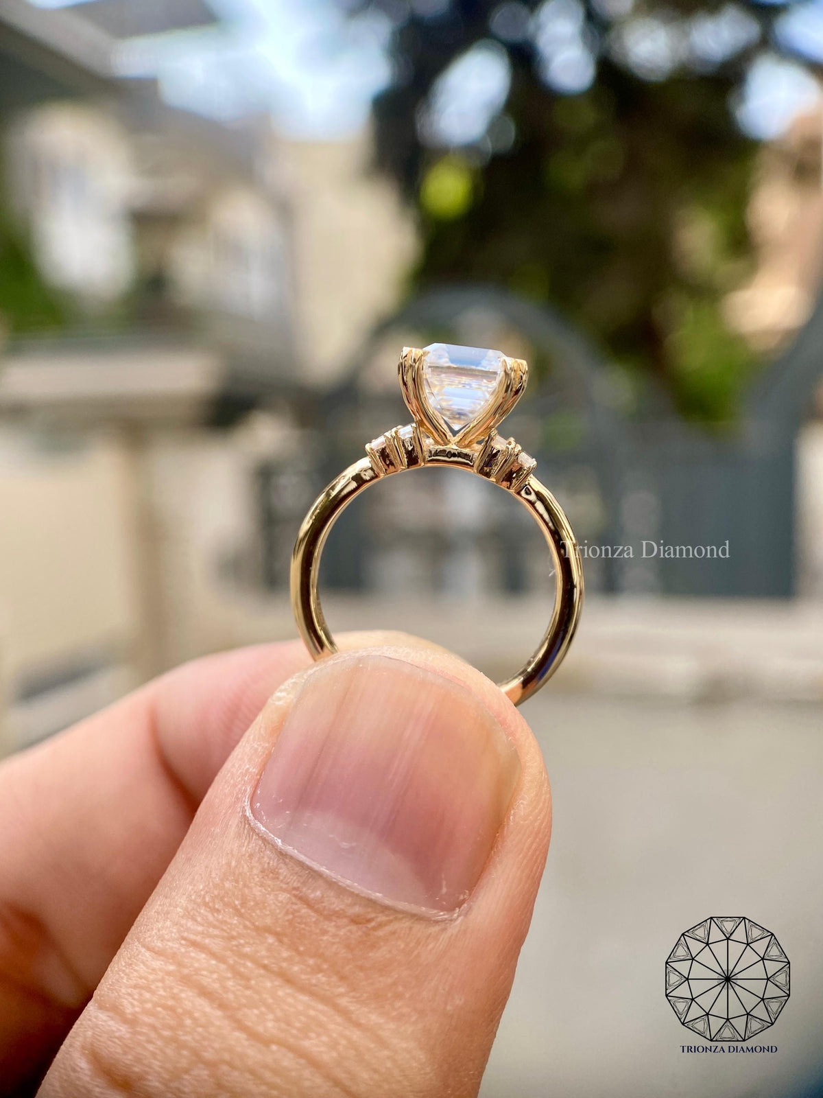 Classic solitaire bridal ring displayed to show its yellow gold setting and side stones
