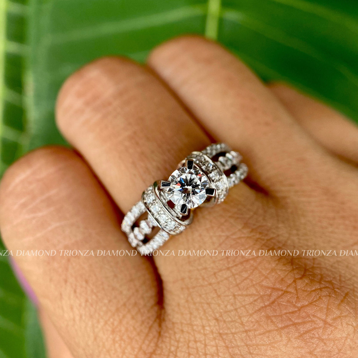 Round cut lab grown diamond engagement ring featuring a trio split shank in 14K white gold