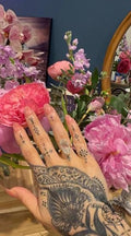 Woman wearing the elongated rose cut diamond engagement ring on her hand