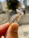 Radiant cut pave wedding band designed to complement the pear shaped center stone