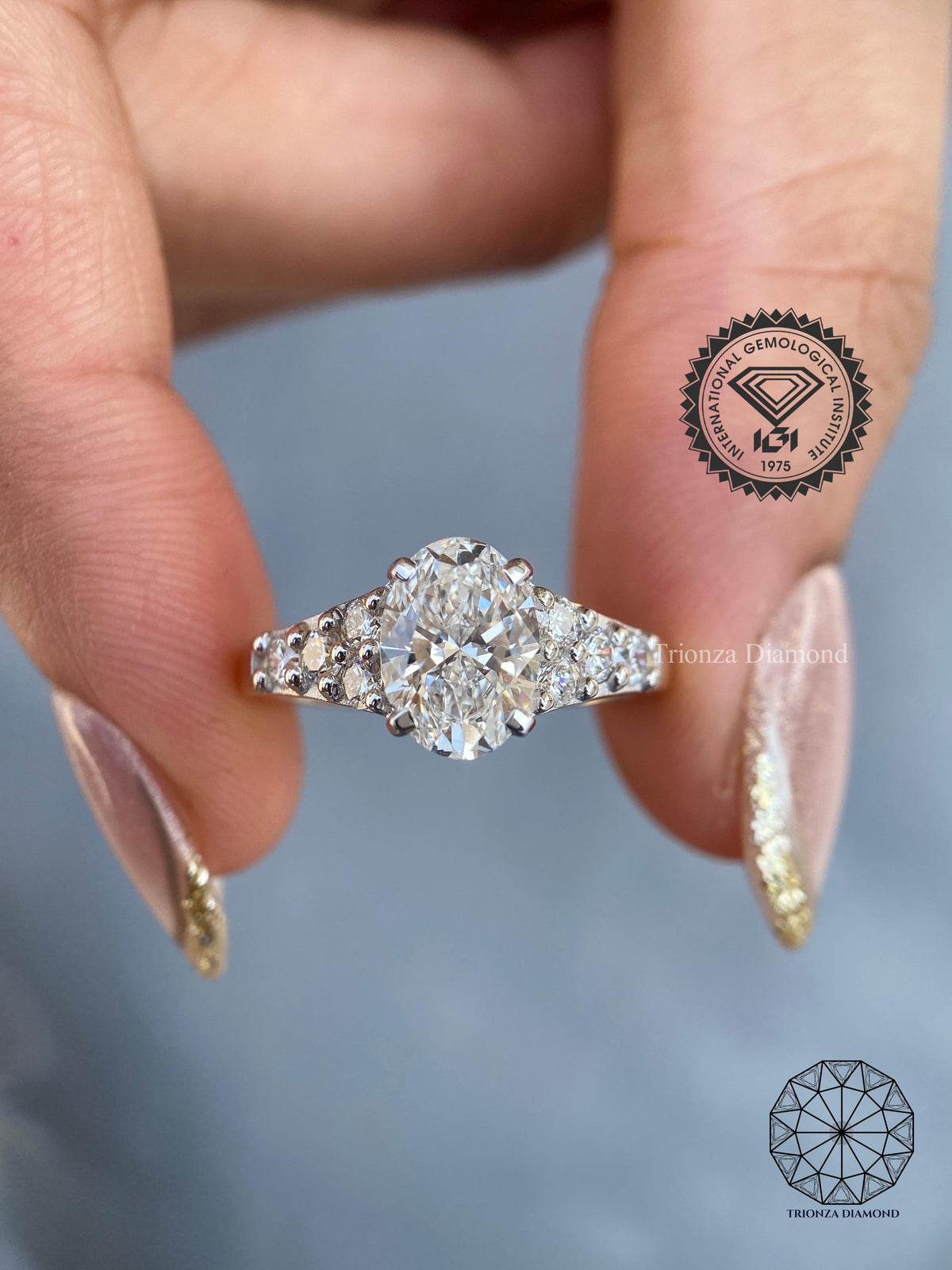 Oval lab grown diamond cluster ring in 14k white gold with a chunky signet band design
